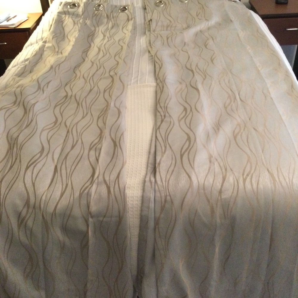 Beige colored black out curtains